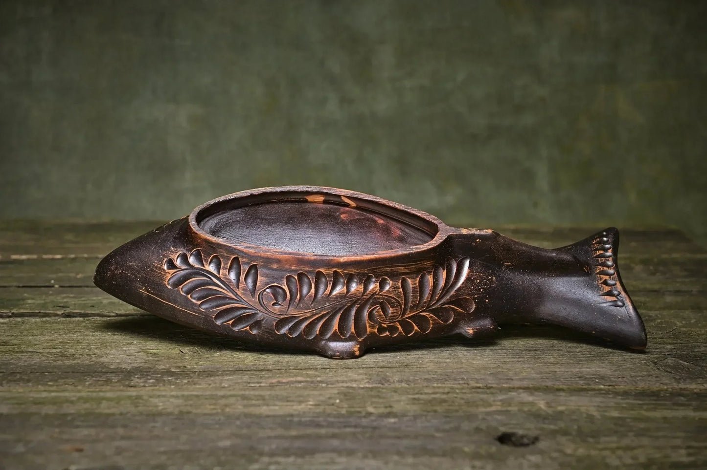 Handmade clay fish-shaped plate with carved leaf design, rustic pottery homeware
