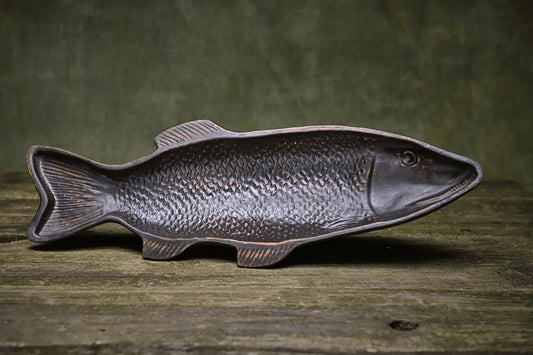 Handmade ceramic fish-shaped serving tray on rustic wood, artisan pottery homeware