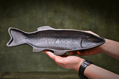 Handmade ceramic fish-shaped dish pottery serving tray held by hands