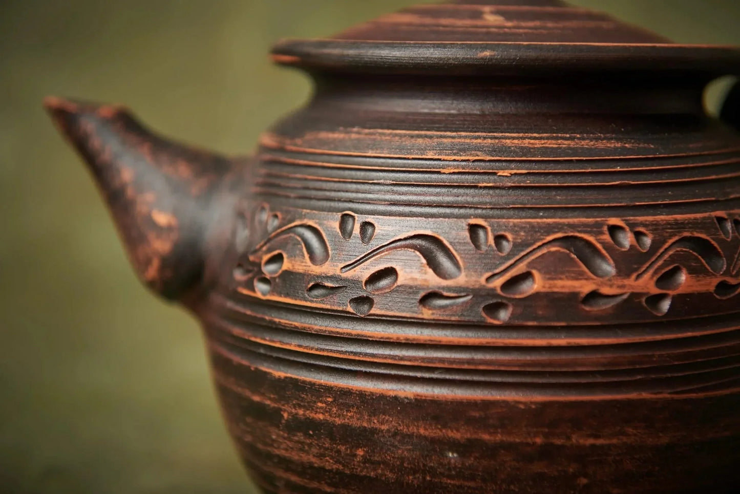 Handcrafted clay teapot with engraved patterns, rustic home decor from clayproductsshop