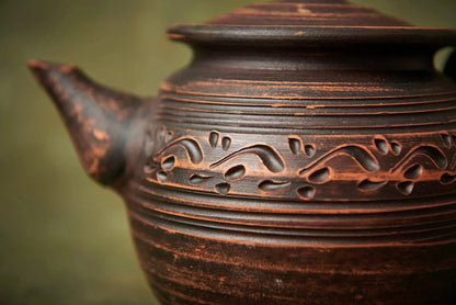 Handcrafted clay teapot with engraved patterns, rustic home decor from clayproductsshop