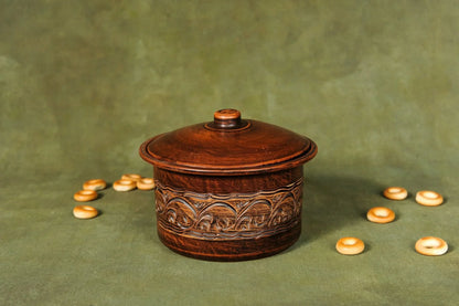 Handmade clay bread baking pan with lid and ornate patterns, rustic kitchen decor.
