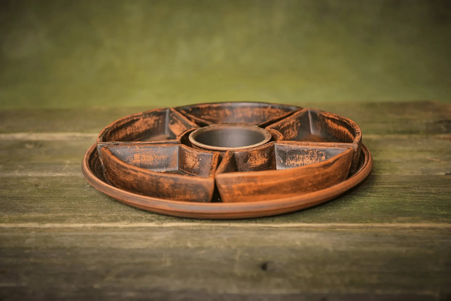 Handmade ceramic serving tray with sectional bowls, rustic finish, on wooden surface