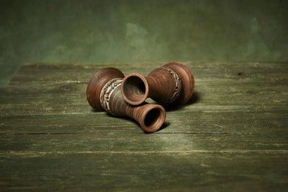 Handmade ceramic candle holders set of 2 with carved detailing on rustic wooden surface