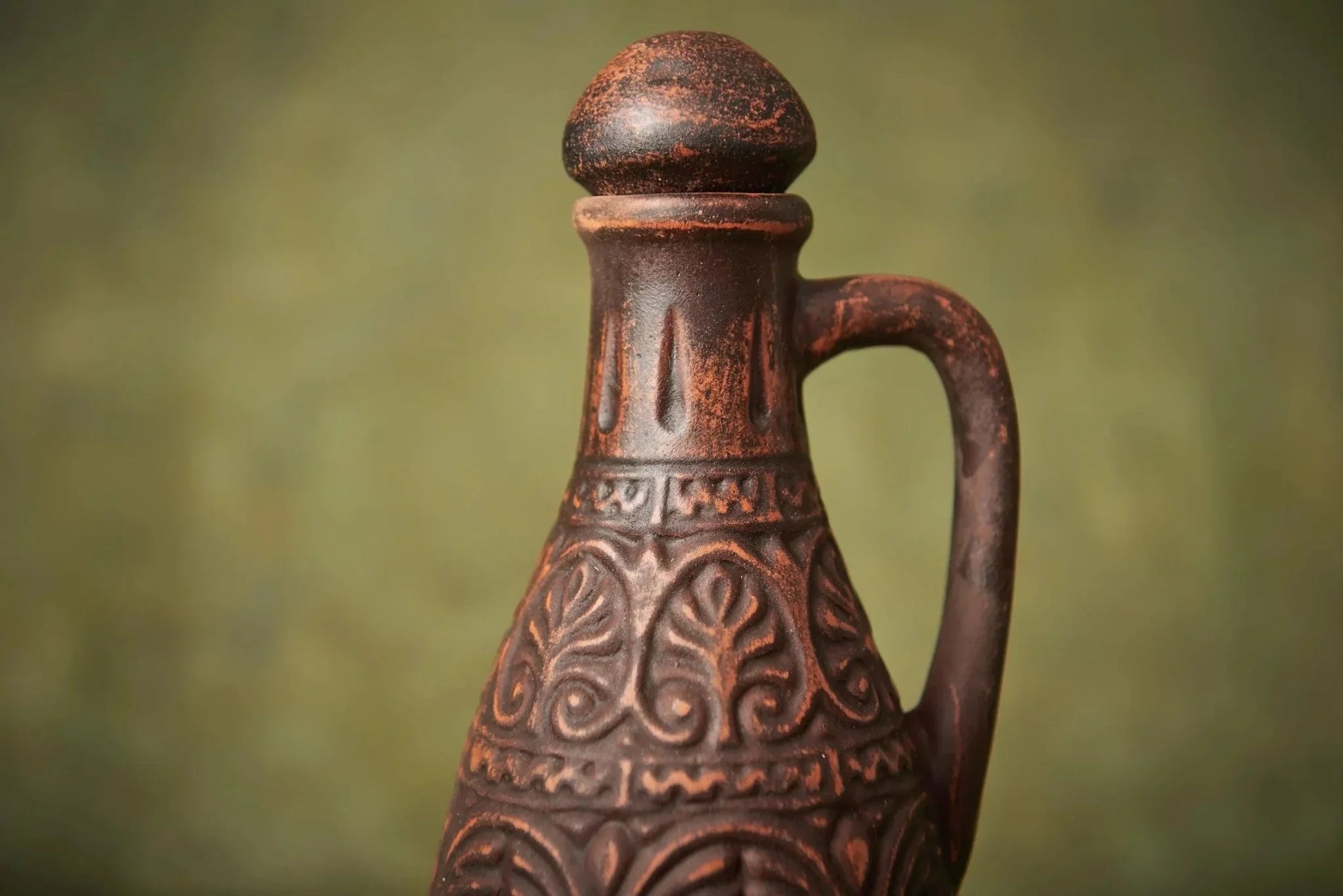 Handmade clay pitcher with lid, textured leaf pattern, farmhouse pottery decor