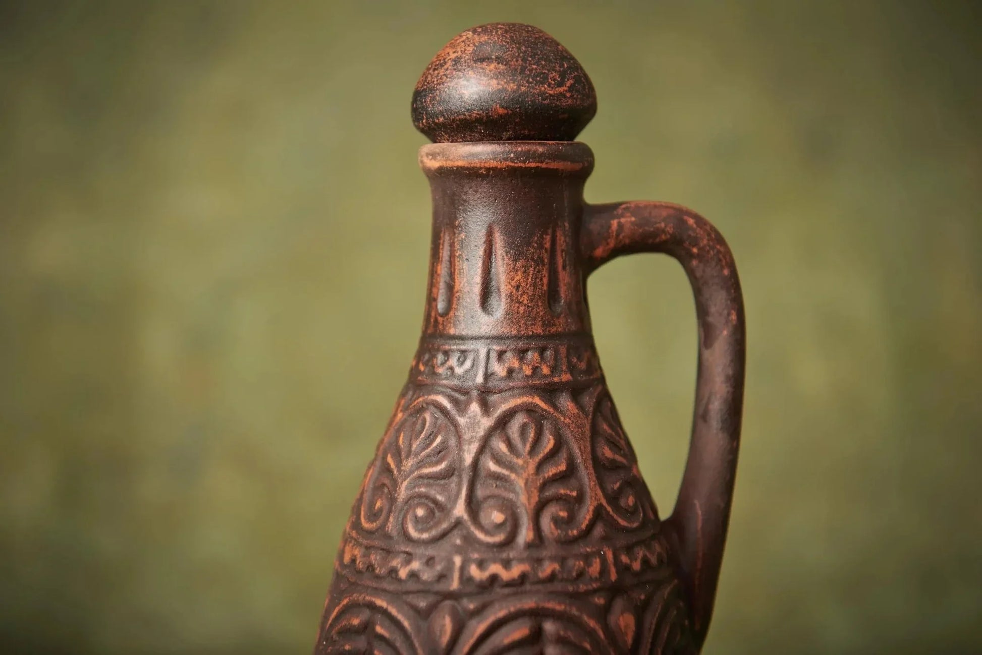 Handmade clay pitcher with lid, ornate patterns, and handle, rustic home decor pottery