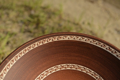 Handmade large red clay ceramic plate with swirl border design, artisan pottery homeware