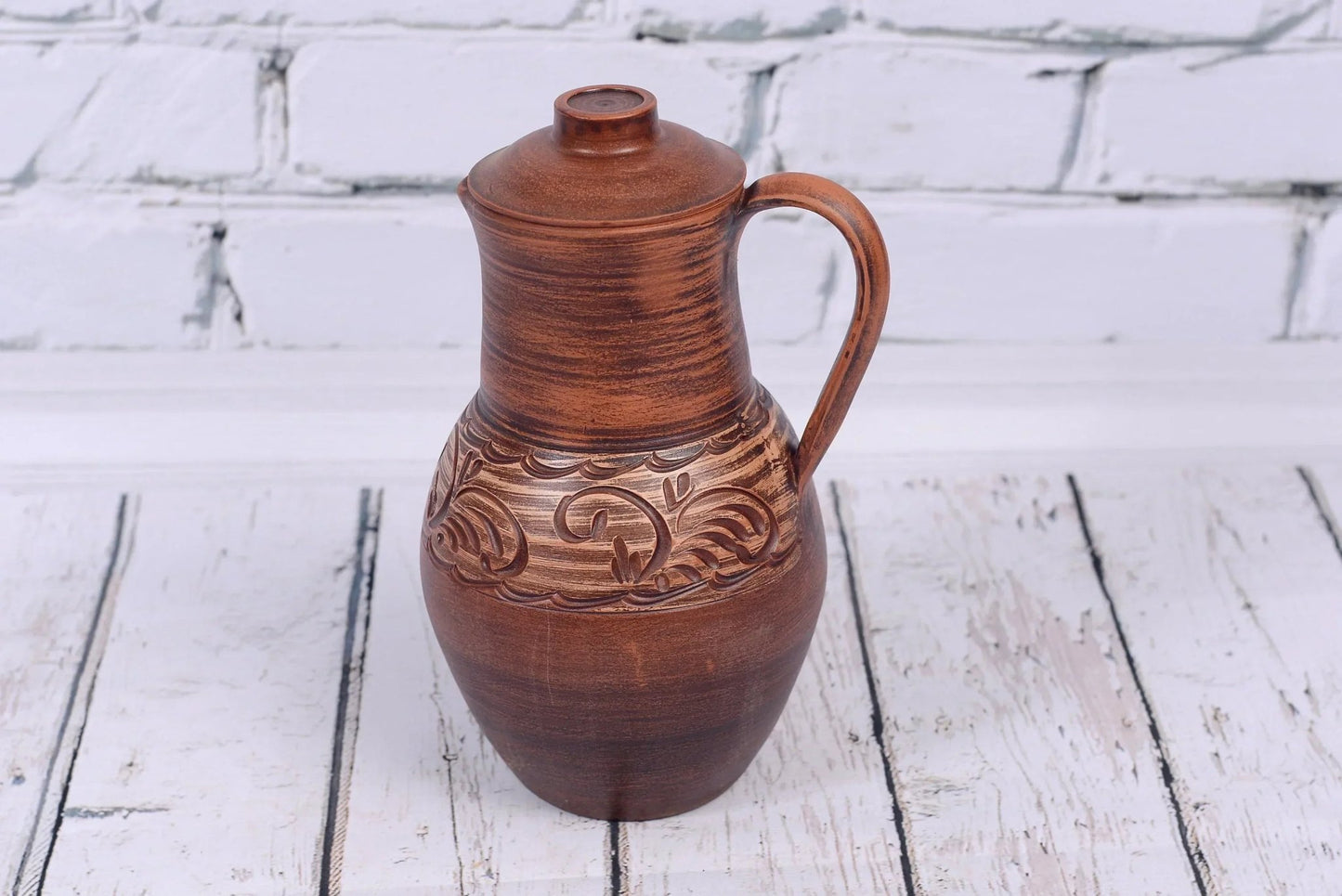Handmade clay jug with lid and handle, rustic ceramic vessel from clayproductsshop