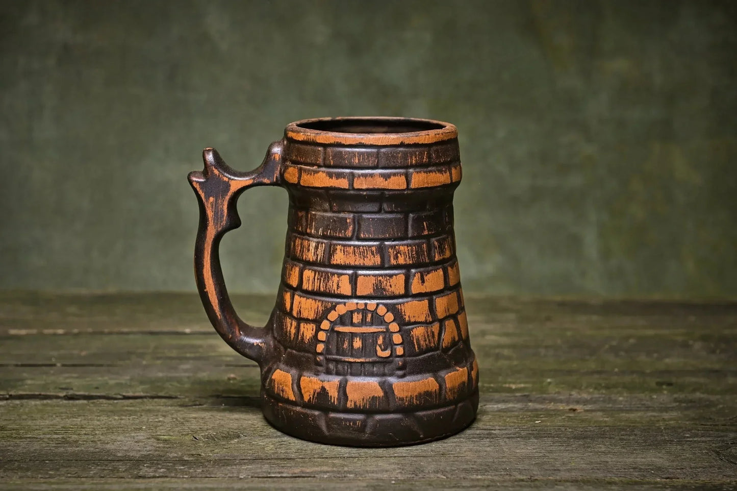 Handcrafted ceramic beer mug made from red clay with brick pattern, rustic homeware