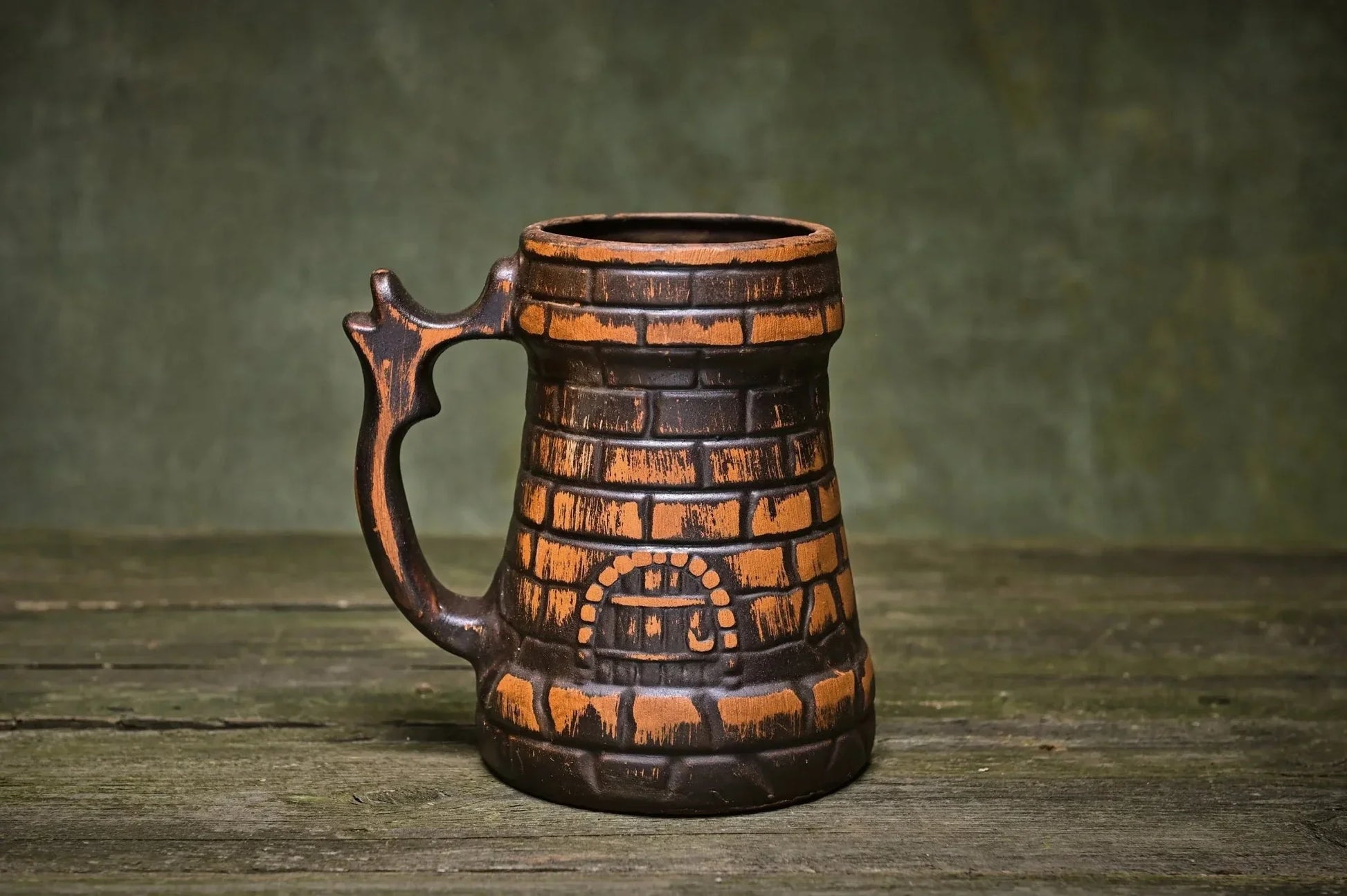 Handcrafted ceramic beer mug made from red clay with brick pattern, rustic homeware
