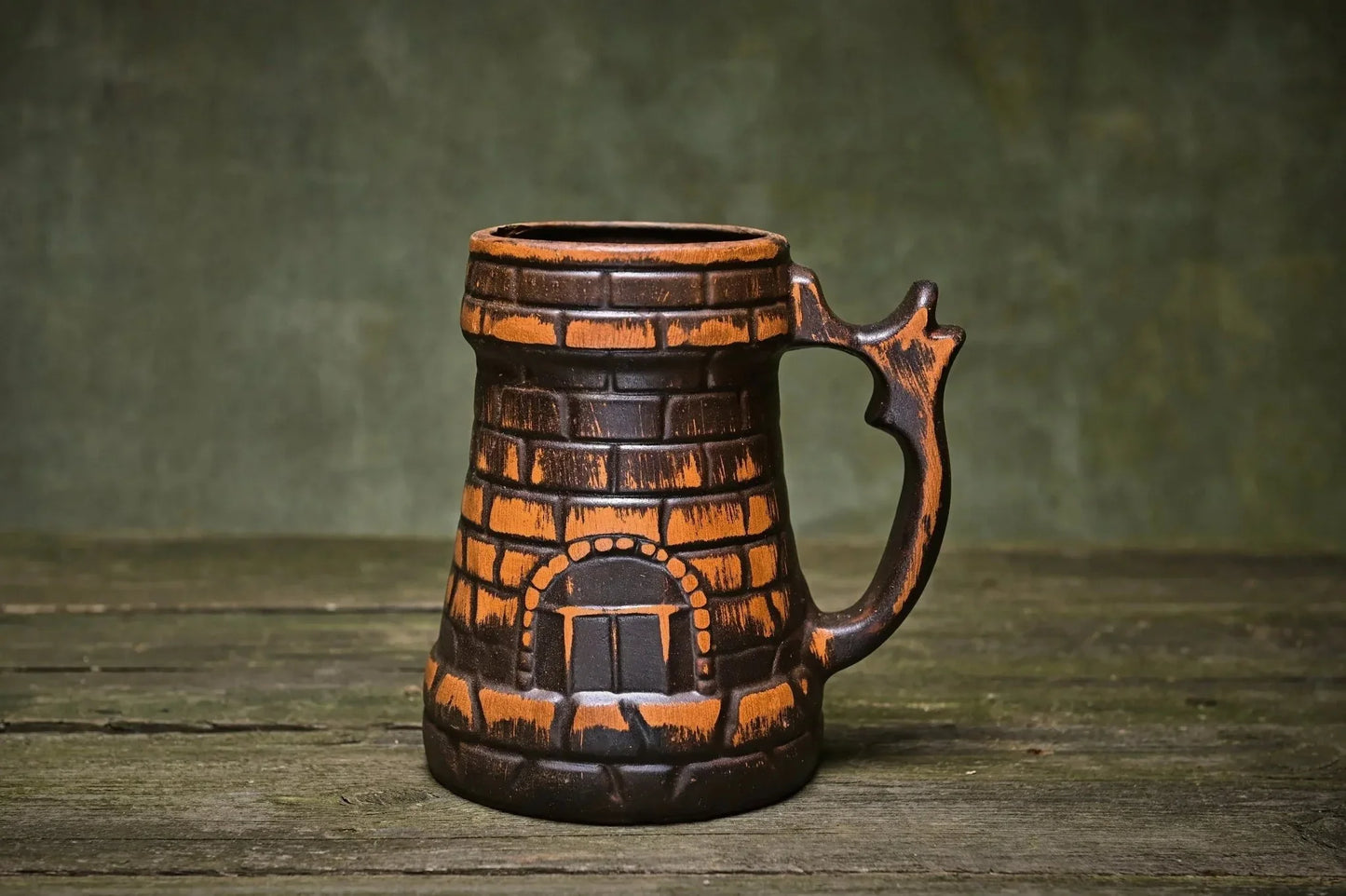 Handcrafted ceramic beer mug with red clay brick pattern on rustic wood, clayproductsshop homeware