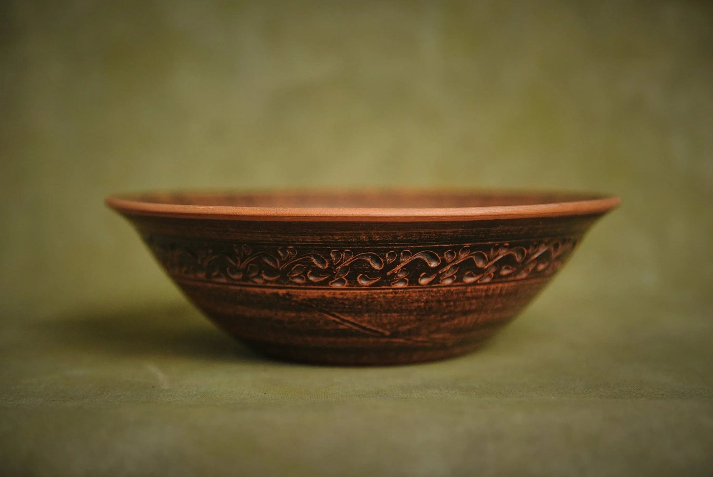 Handmade red clay ceramic bowl with engraved pattern, artisan pottery homeware
