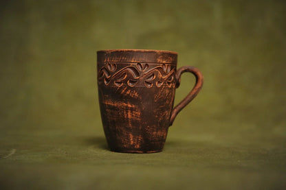 Handmade red clay ceramic cup with engraved ethnic pattern, artisan pottery homeware