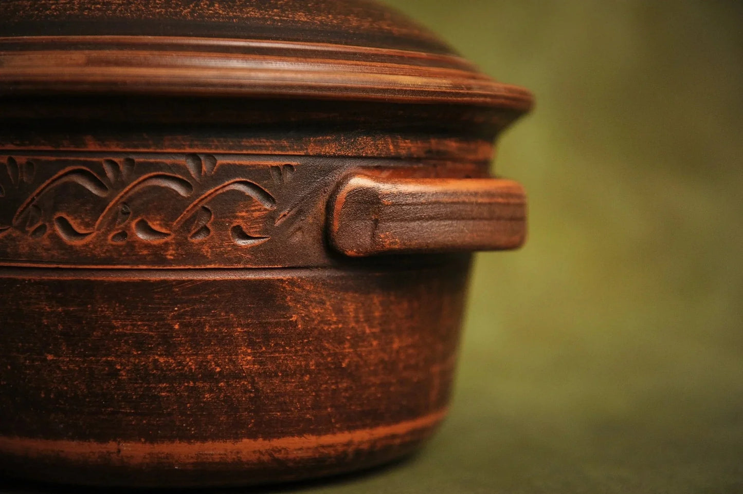 Handmade clay casserole pot with lid and decorative etching, rustic homeware