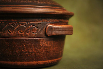 Handmade clay casserole pot with lid and decorative etching, rustic homeware