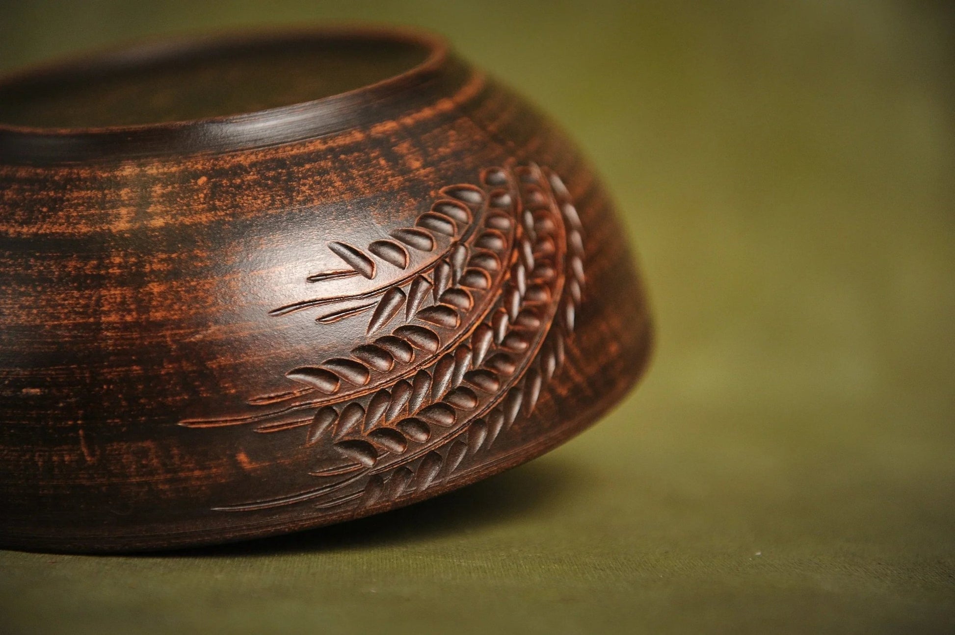 Handmade rustic ceramic salad bowl with engraved leaf pattern, artisan clay dinnerware