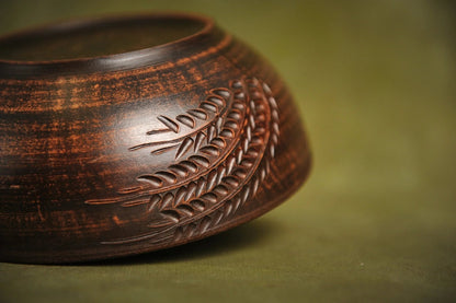 Handmade rustic ceramic salad bowl with engraved leaf pattern, artisan clay dinnerware