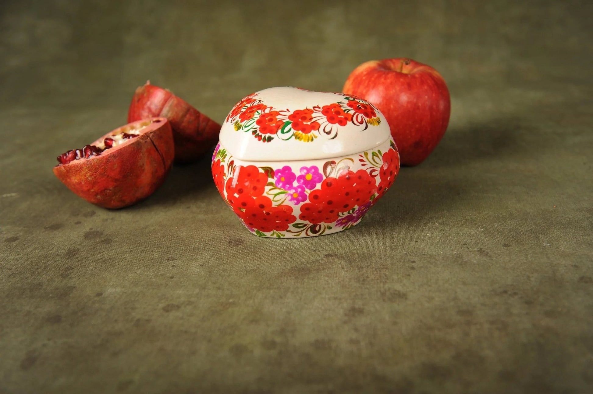 Hand-painted ceramic heart-shaped trinket box with floral design, apples and pomegranate
