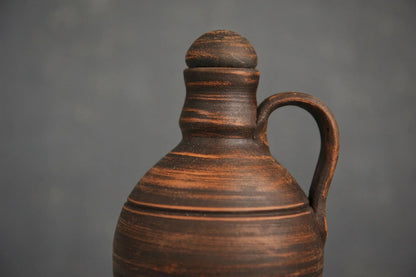 Handmade red clay jug with handle and lid, artisan pottery from clayproductsshop