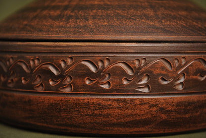 Handmade clay pot with intricate organic carvings, artisan ceramic cookware from clayproductsshop