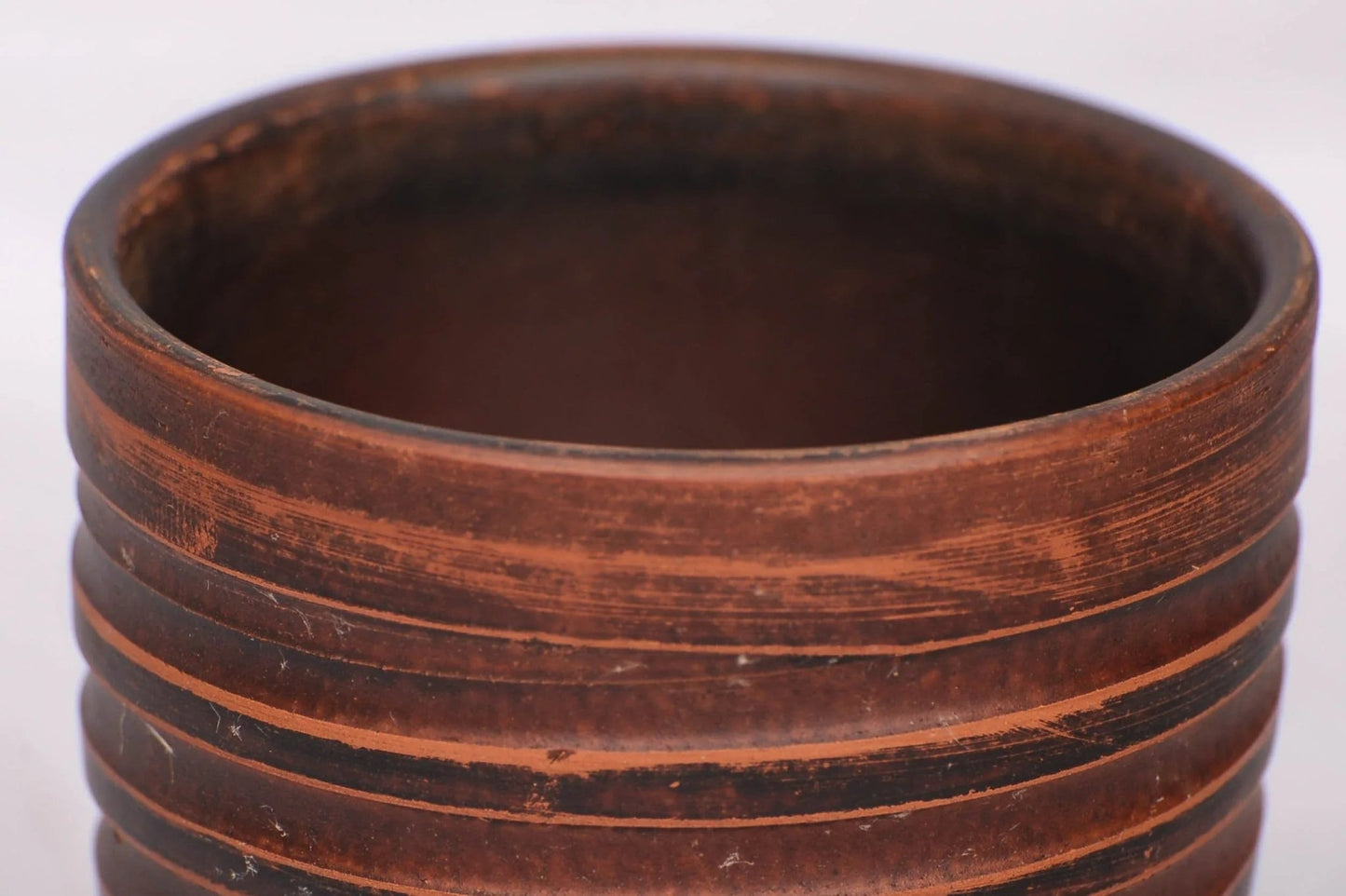 Handmade clay tumbler with textured brown stripes, artisan pottery cup, 200 ml