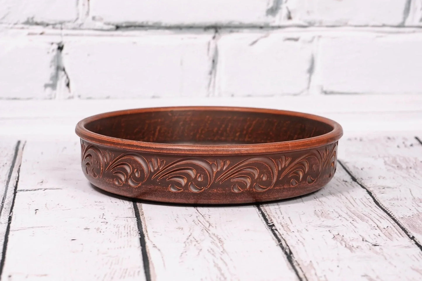 Handmade clay pancake maker plate with ornate pattern, artisan ceramic kitchen decor tray
