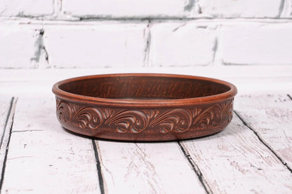 Handmade clay pancake maker plate with ornate pattern, artisan ceramic kitchen decor tray