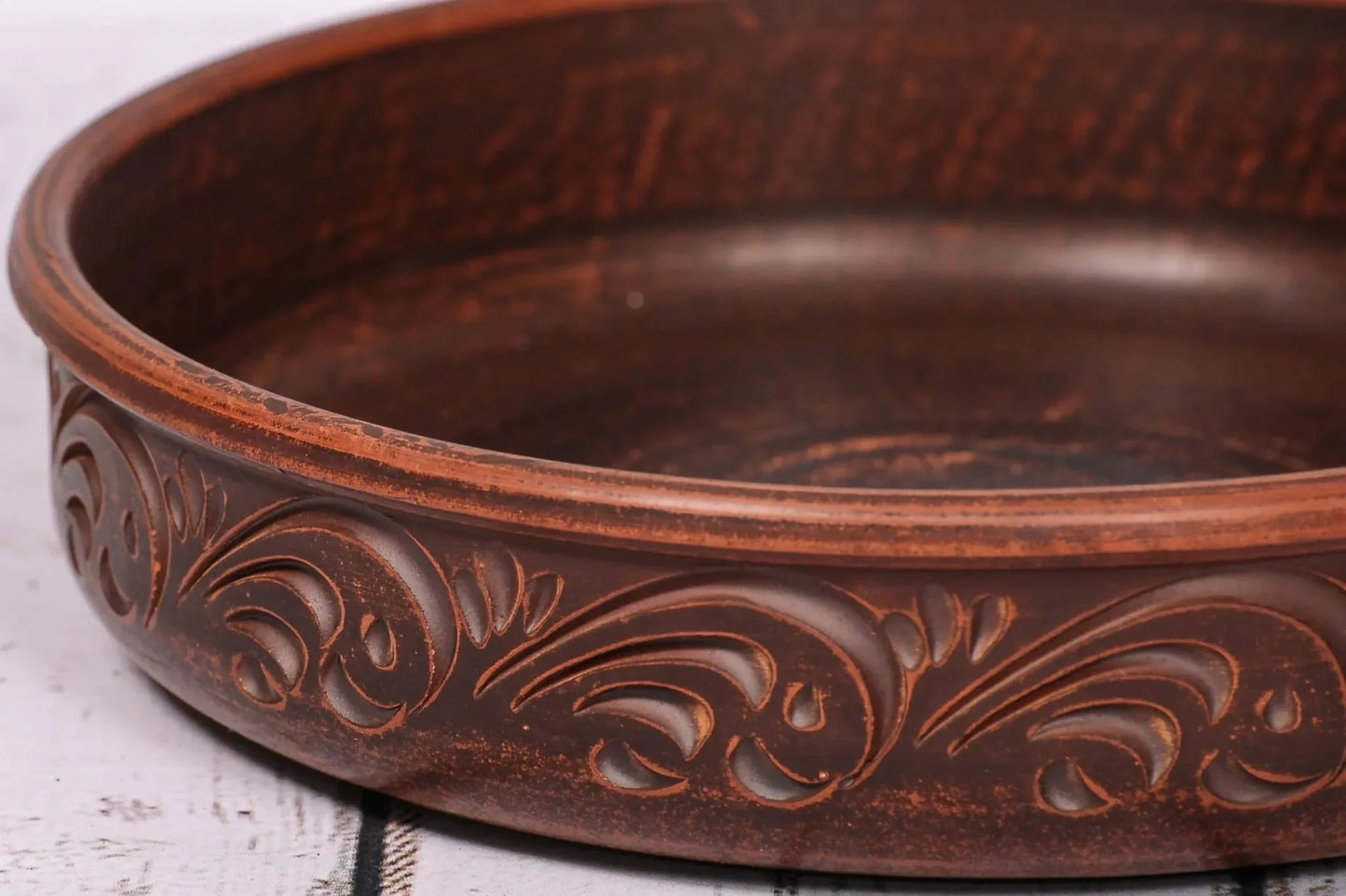 Handmade clay pancake maker plate with carved details, artisan ceramic kitchenware