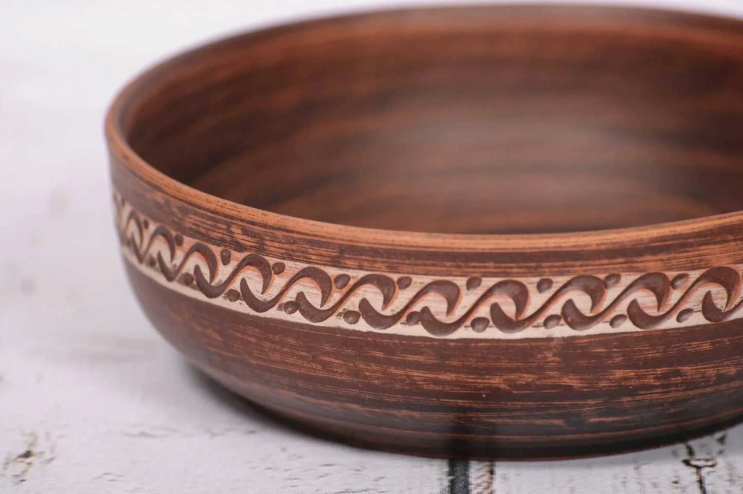 Handmade red clay bowl with rustic pattern, artisan ceramic homeware from clayproductsshop